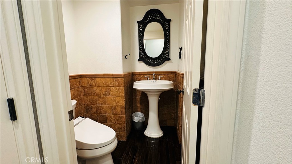 24 Silhouette Irvine, CA 92603 - Photo 13 of 36 a bathroom with a toilet sink and mirror