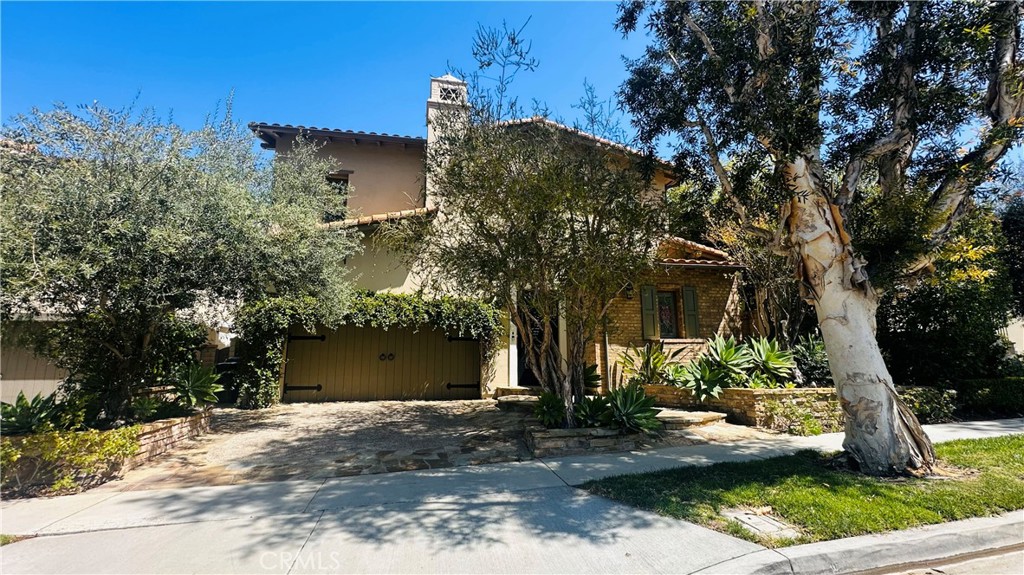 24 Silhouette Irvine, CA 92603 - Photo 2 of 36 a front view of a house with a yard