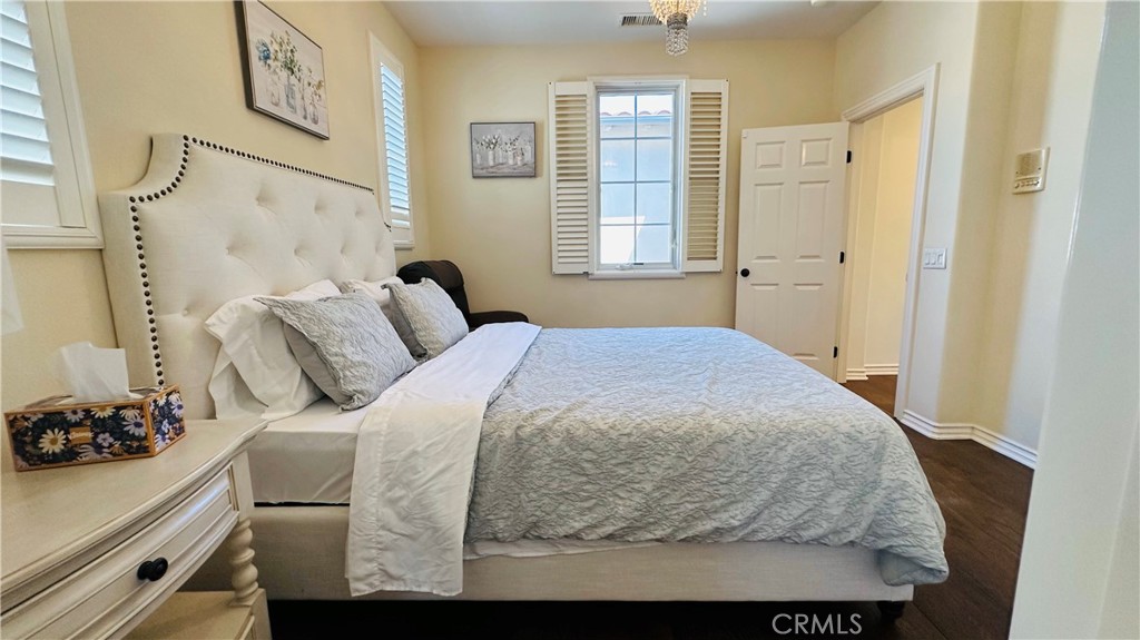 24 Silhouette Irvine, CA 92603 - Photo 22 of 36 a bedroom with a bed and a window