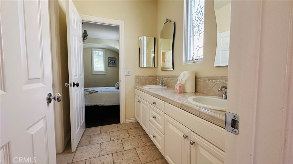 24 Silhouette Irvine, CA 92603 - Photo 23 of 36 a bathroom with a sink and a mirror
