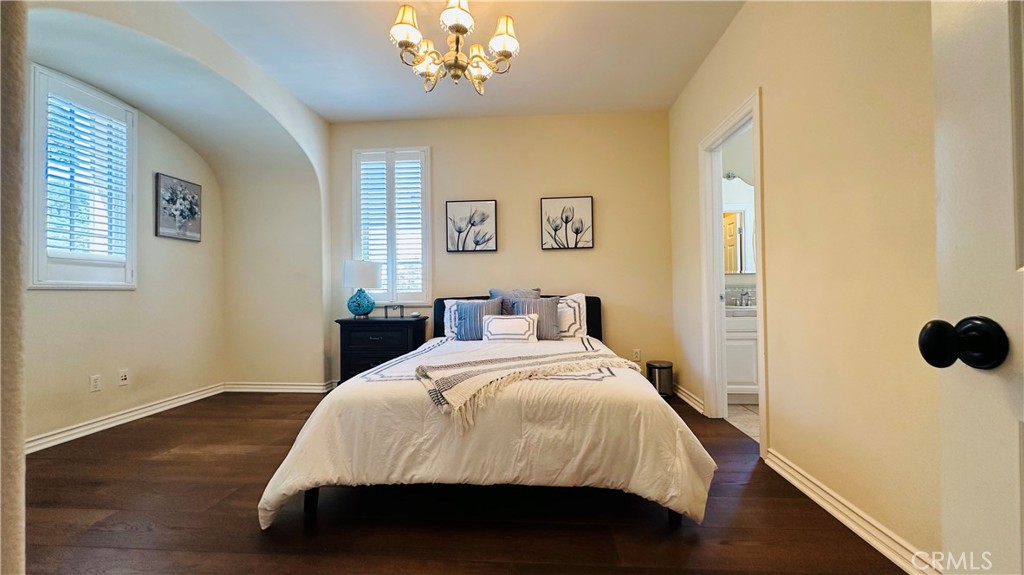 24 Silhouette Irvine, CA 92603 - Photo 26 of 36 a spacious bedroom with a bed and a window