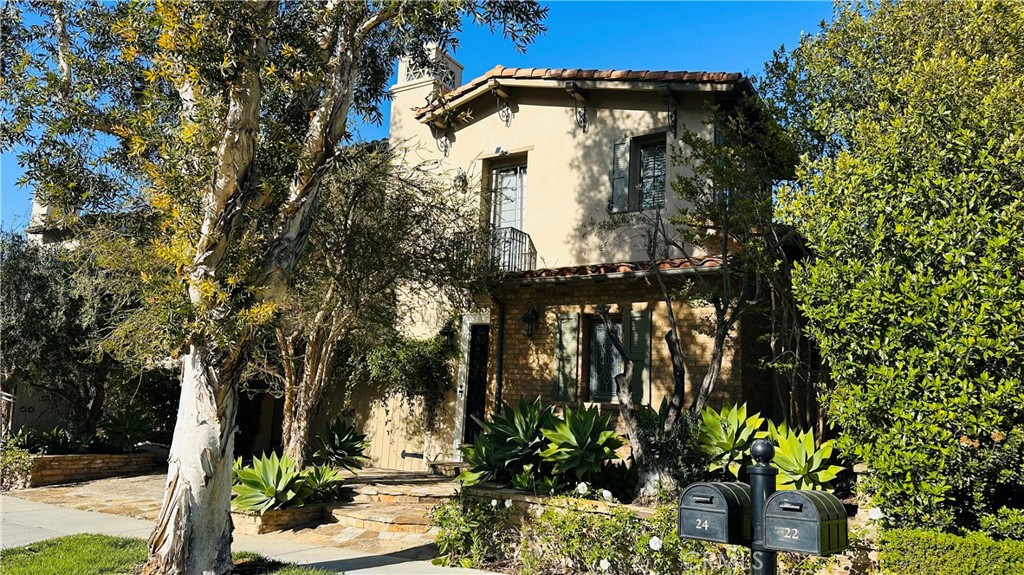 24 Silhouette Irvine, CA 92603 - Photo 3 of 36 a front view of a house with a yard