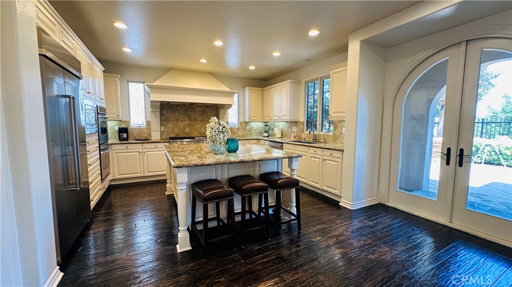 24 Silhouette Irvine, CA 92603 - Photo 10 of 36 a kitchen with refrigerator cabinets and wooden floor