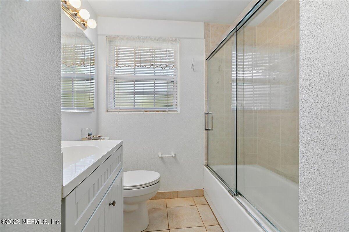 8543 Synhoff Drive Jacksonville, FL 32216 - Photo 14 of 19 a bathroom with a sink a toilet and shower
