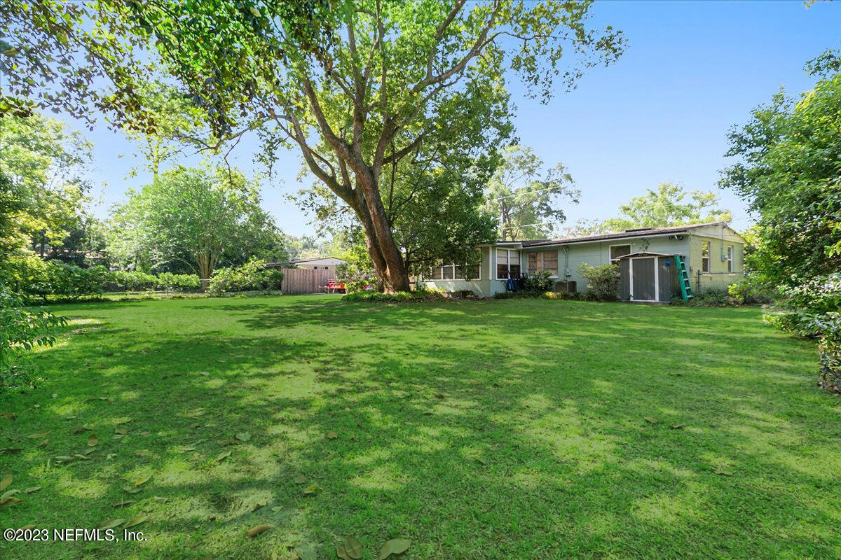 8543 Synhoff Drive Jacksonville, FL 32216 - Photo 19 of 19 a front view of a house with yard and green space