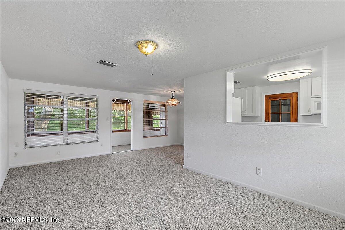 8543 Synhoff Drive Jacksonville, FL 32216 - Photo 3 of 19 a view of an empty room with a window
