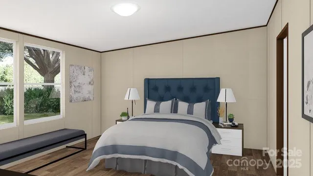 a bedroom with a bed and wooden floor