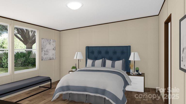 660 Pinehurst Road Ellenboro, NC 28040 - Photo 13 of 29 a bedroom with a bed and wooden floor