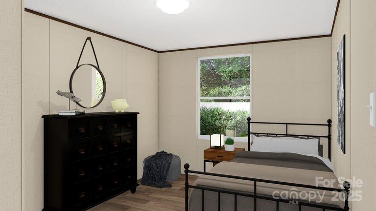 660 Pinehurst Road Ellenboro, NC 28040 - Photo 17 of 29 a bedroom with a bed and a mirror