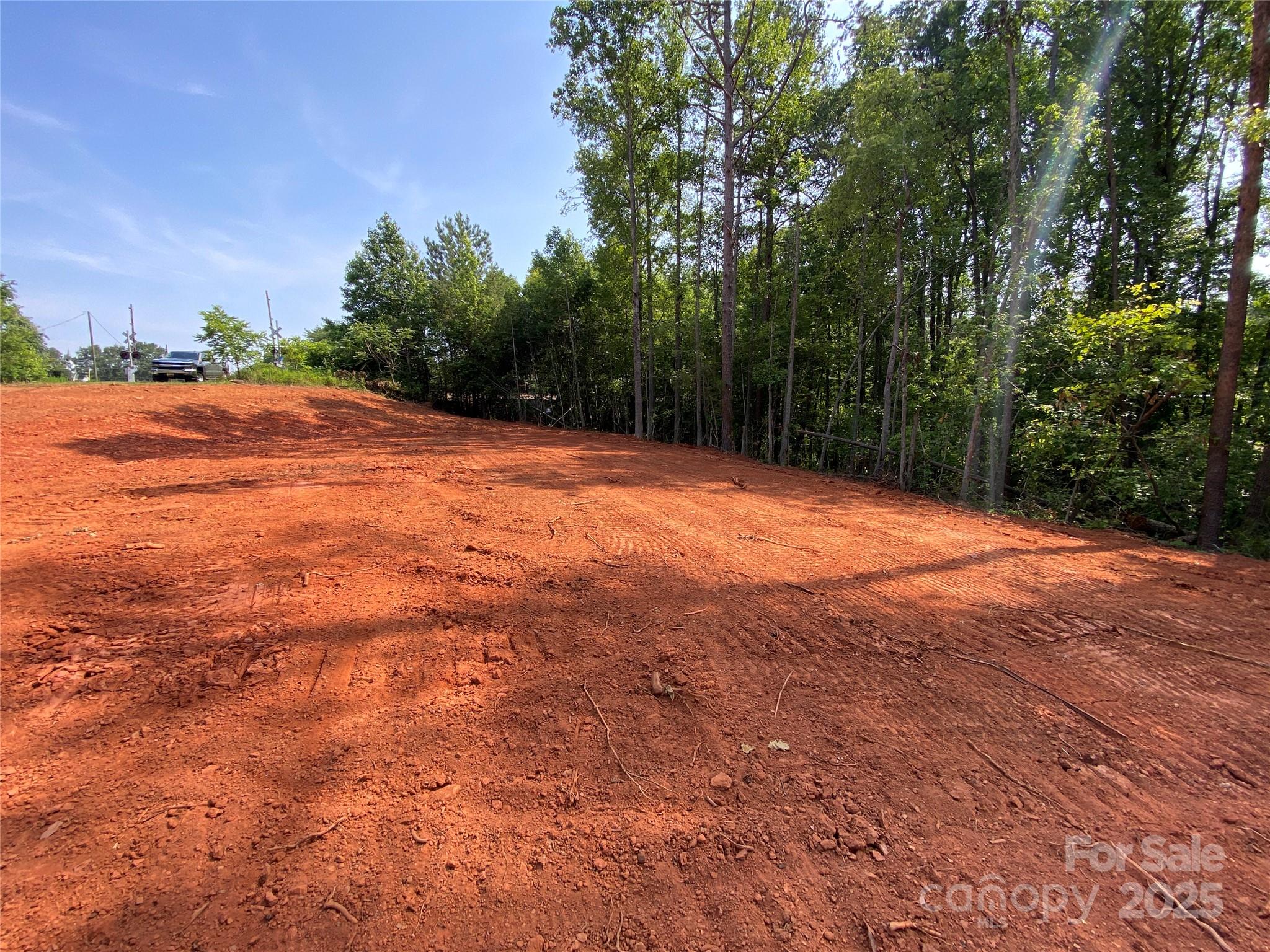 660 Pinehurst Road Ellenboro, NC 28040 - Photo 23 of 29 a backyard of a house with lots of green space