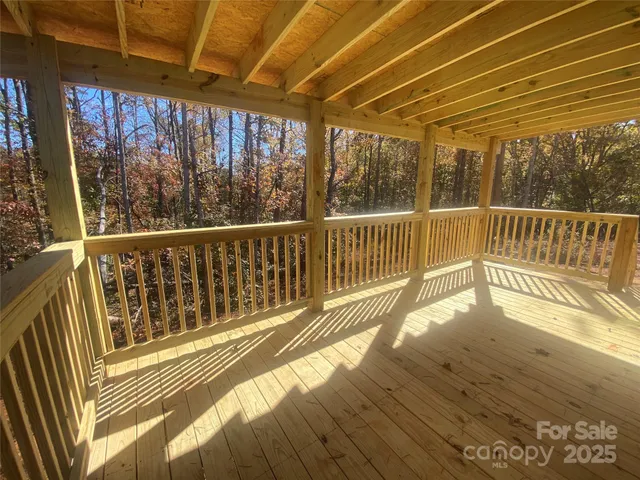 a view of balcony with wooden floor