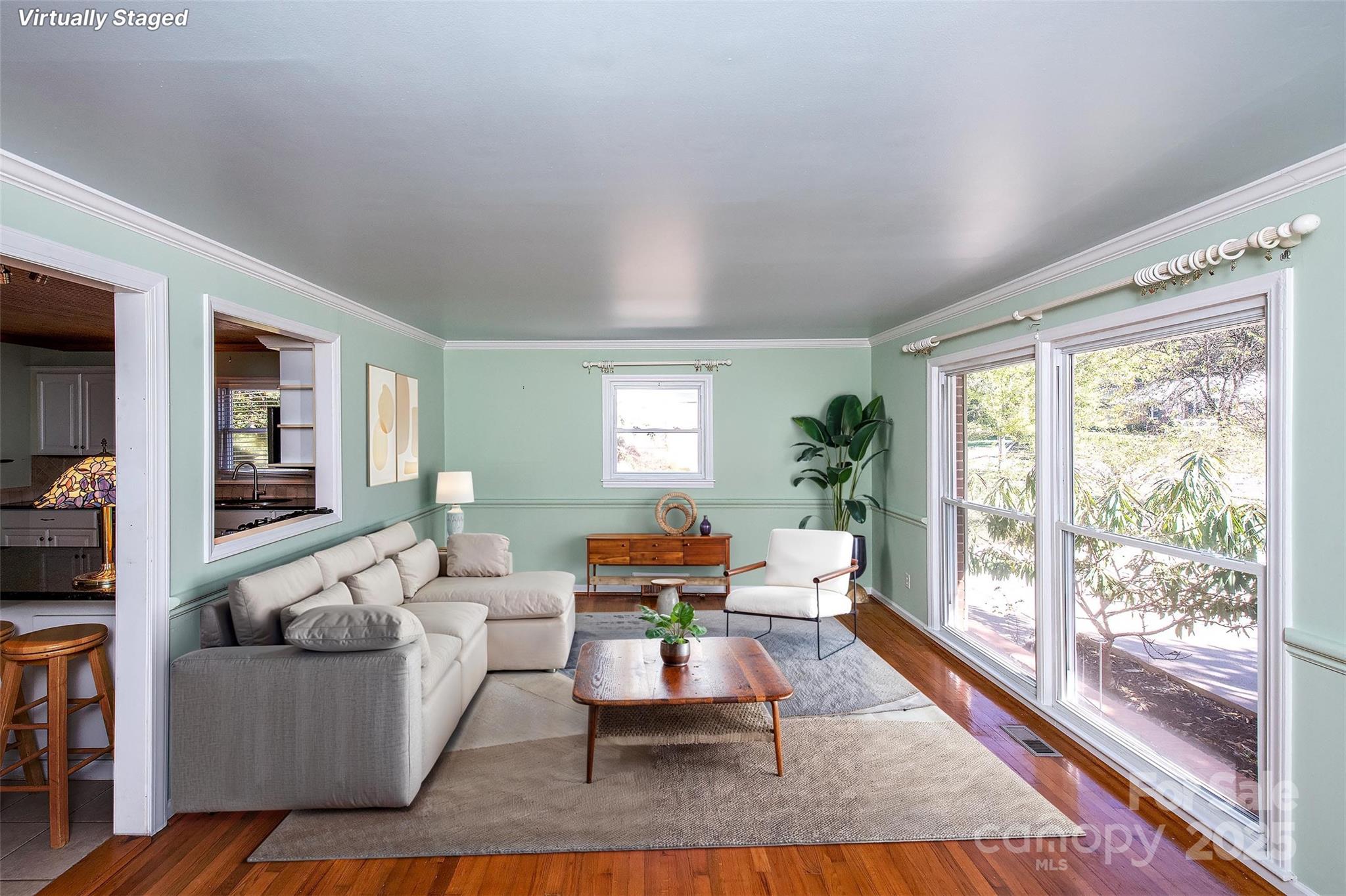 6332 Montpelier Road Charlotte, NC 28210 - Photo 11 of 30 a living room with furniture and a large window
