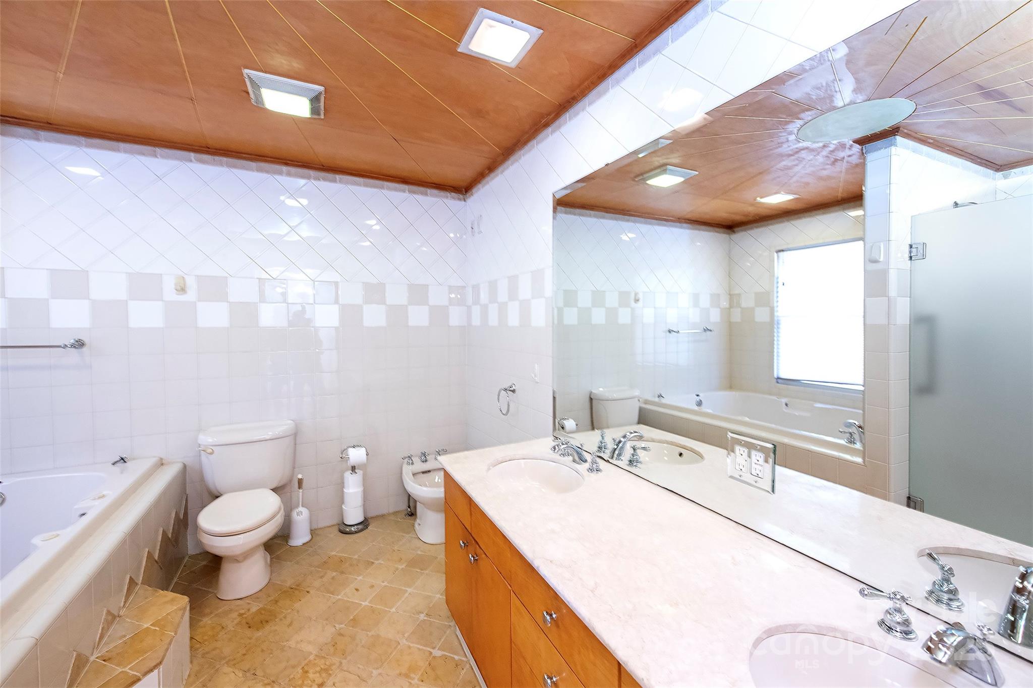 6332 Montpelier Road Charlotte, NC 28210 - Photo 24 of 30 a spacious bathroom with a granite countertop sink a toilet and a large mirror