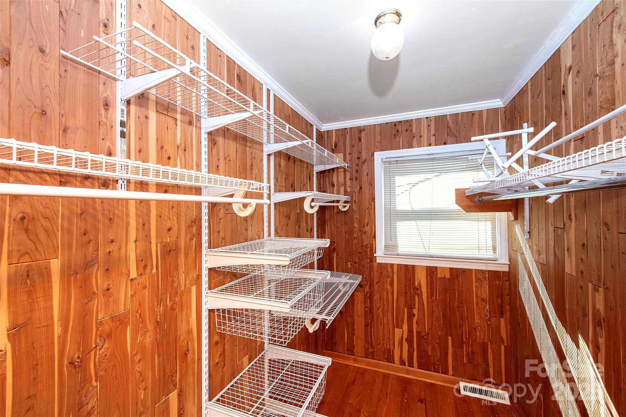 6332 Montpelier Road Charlotte, NC 28210 - Photo 26 of 30 a room with wooden floor and windows