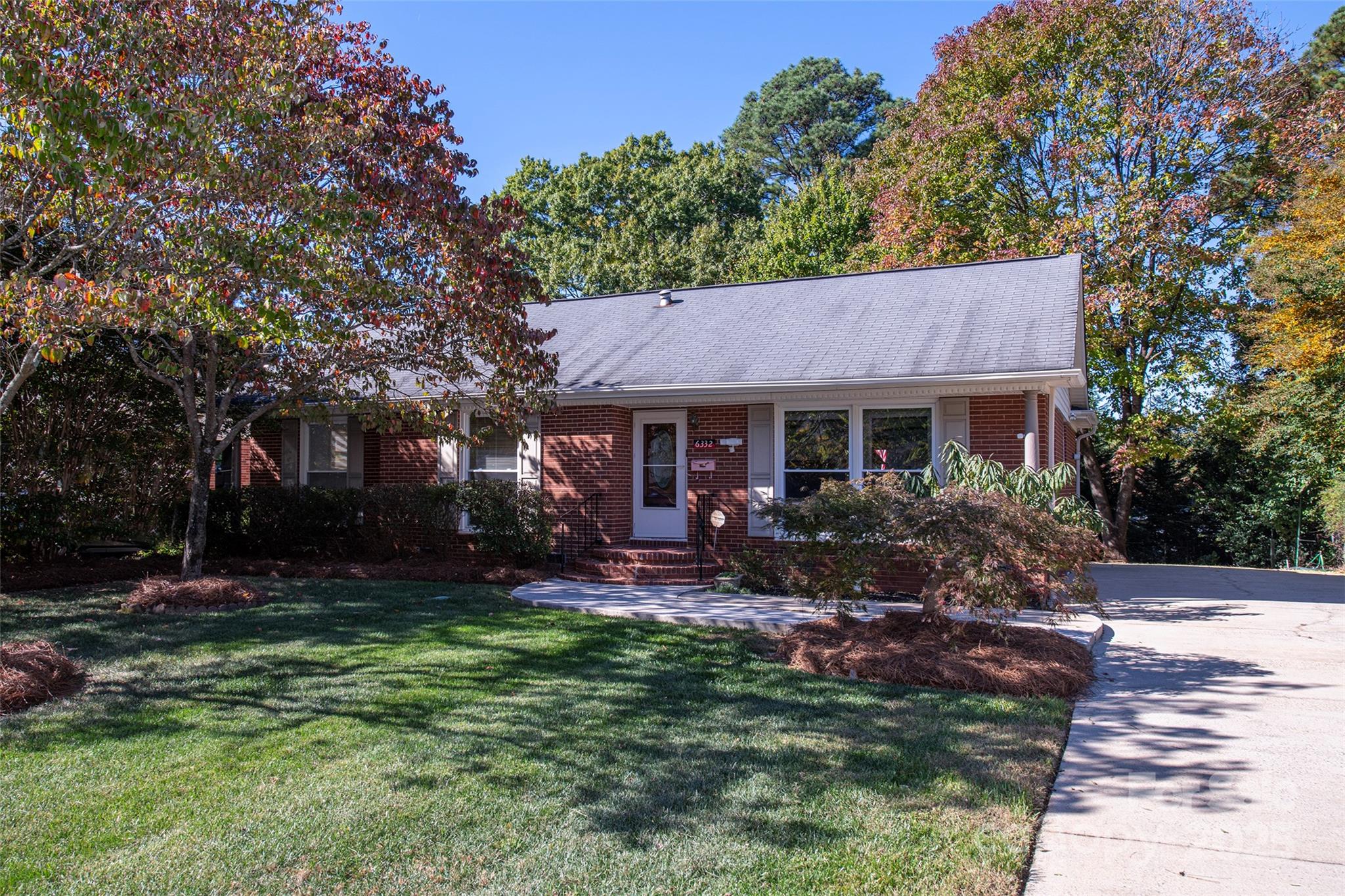 6332 Montpelier Road Charlotte, NC 28210 - Photo 3 of 30 a view of a house with a yard and tree s