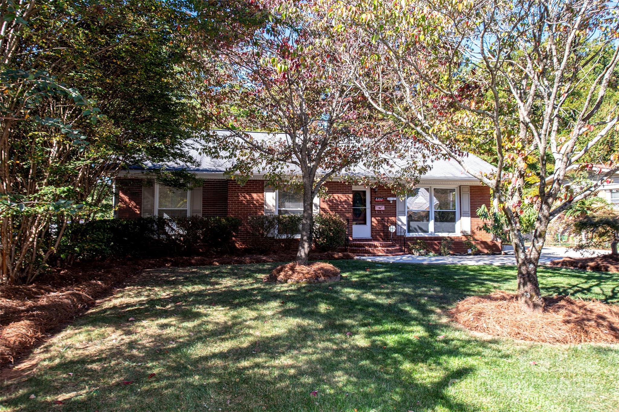 6332 Montpelier Road Charlotte, NC 28210 - Photo 4 of 30 a view of a house with a yard porch and sitting area