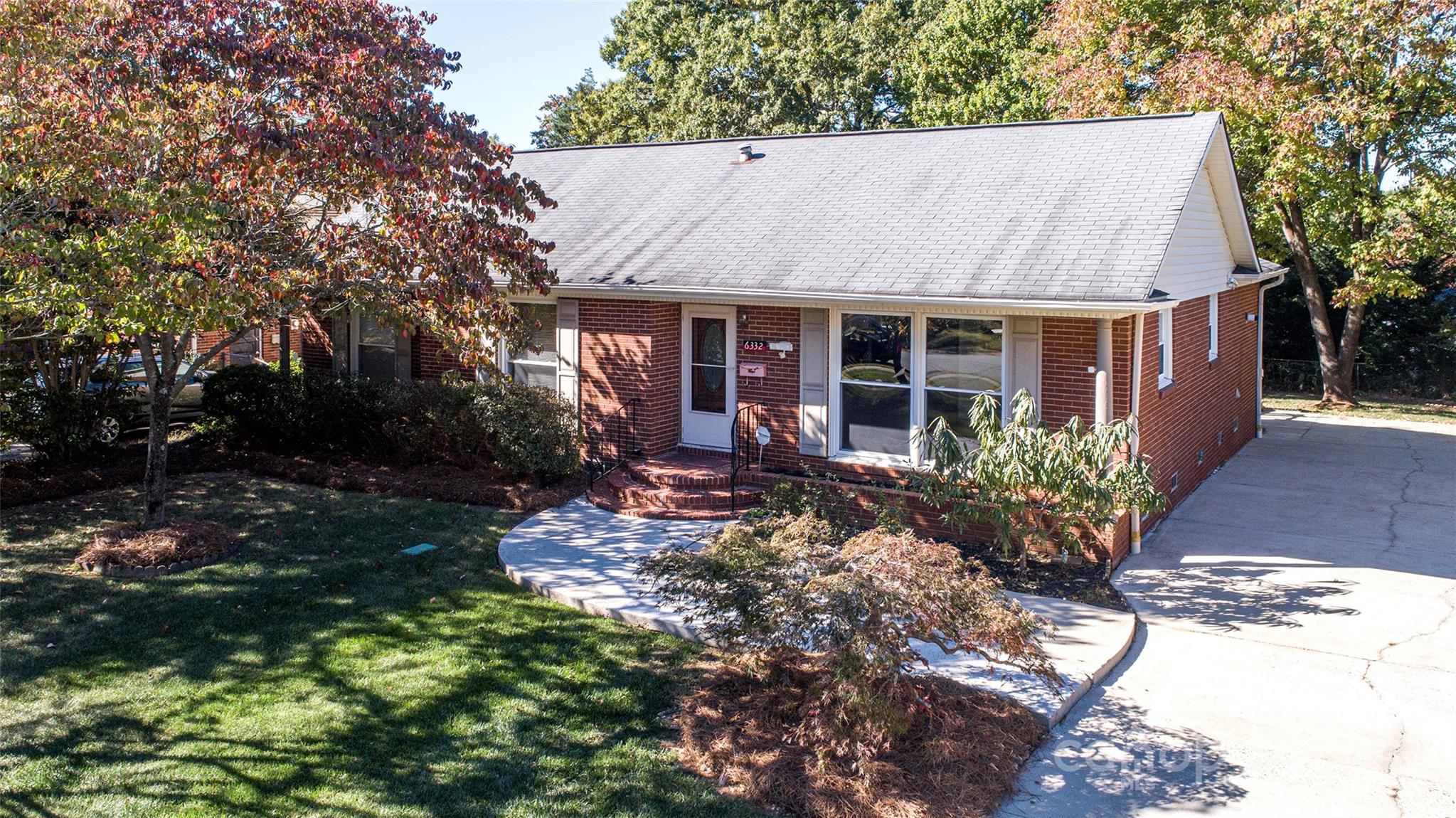 6332 Montpelier Road Charlotte, NC 28210 - Photo 5 of 30 a view of a house with yard and garden