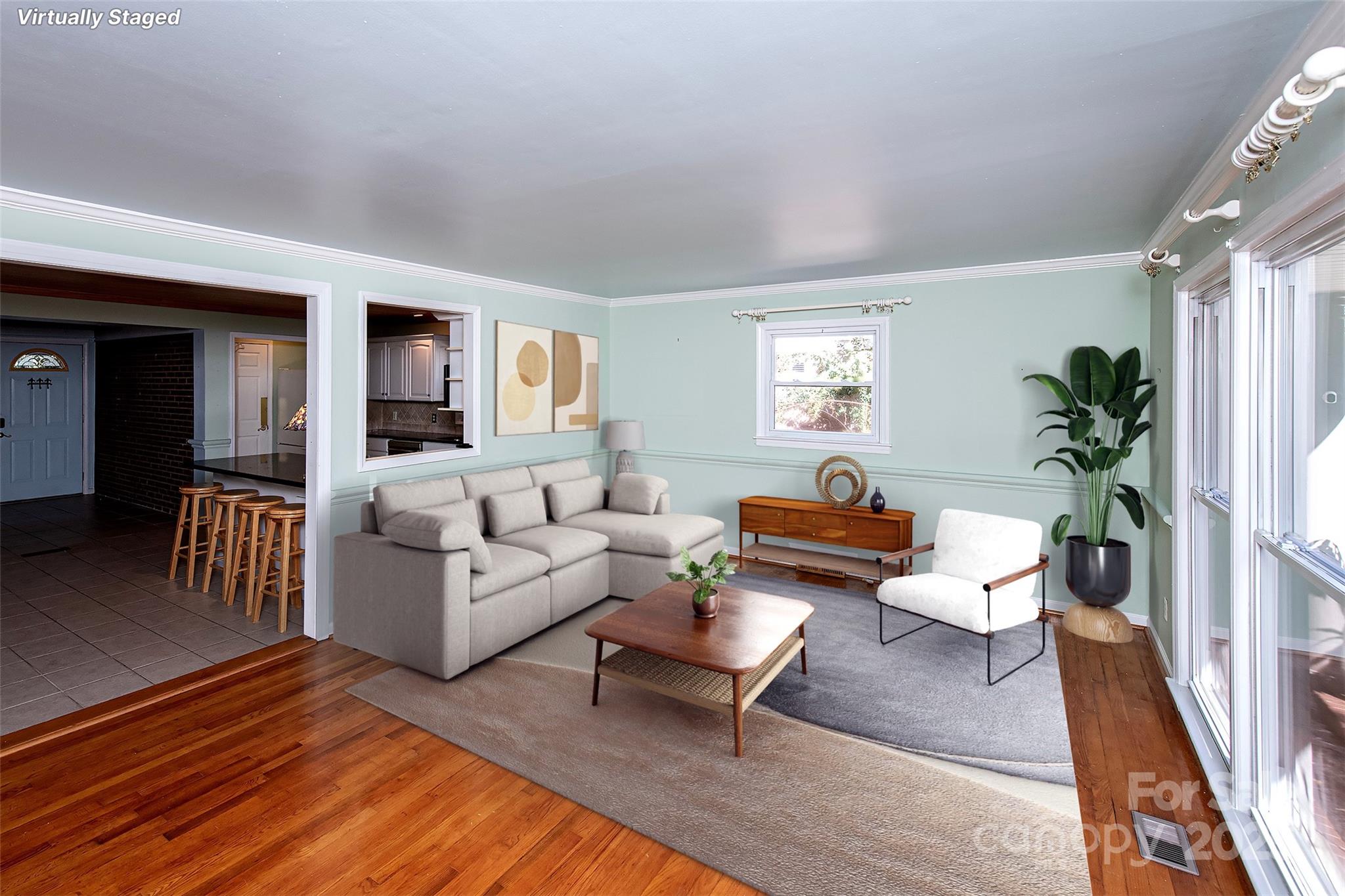 6332 Montpelier Road Charlotte, NC 28210 - Photo 10 of 30 a living room with furniture and a wooden floor