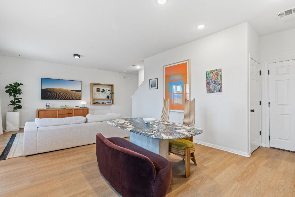 6703 Routenburn Street Austin, TX 78754 - Photo 12 of 34 a living room with furniture and a flat screen tv