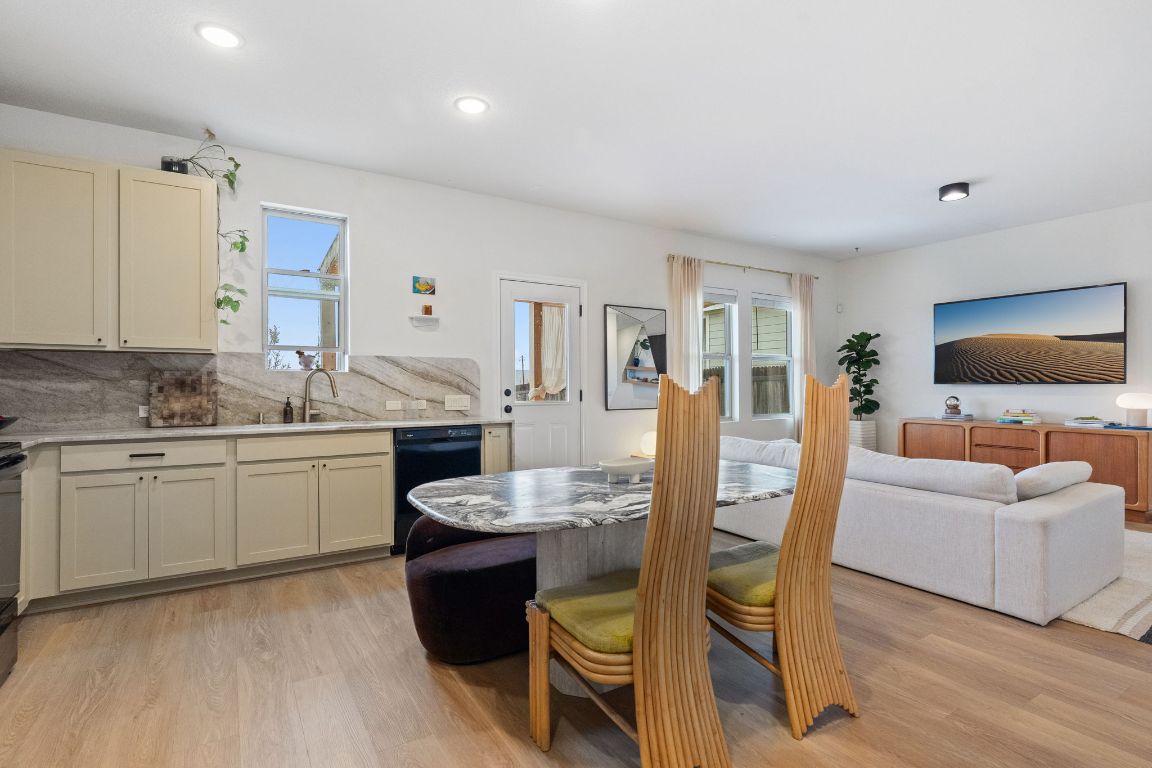 6703 Routenburn Street Austin, TX 78754 - Photo 14 of 34 a living room with furniture and a flat screen tv