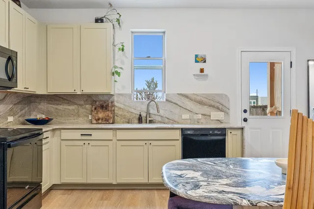 a kitchen with a sink and cabinets