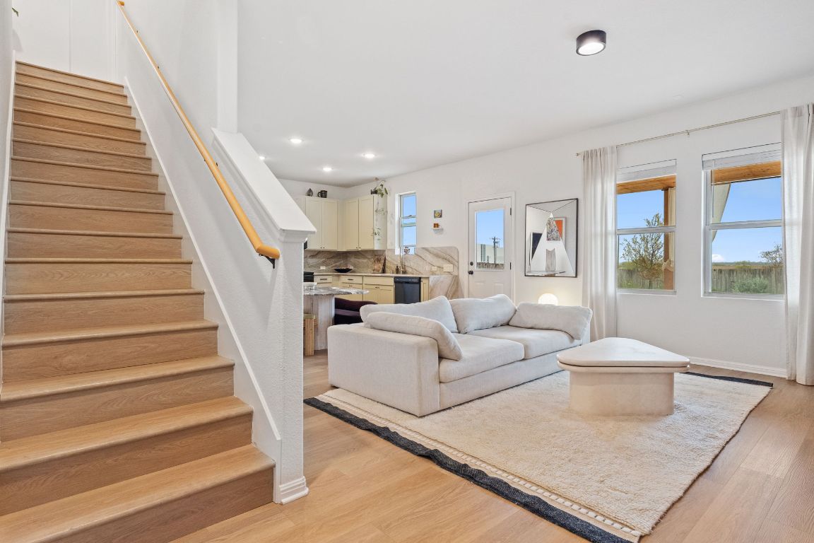 6703 Routenburn Street Austin, TX 78754 - Photo 19 of 34 a living room with furniture and a rug