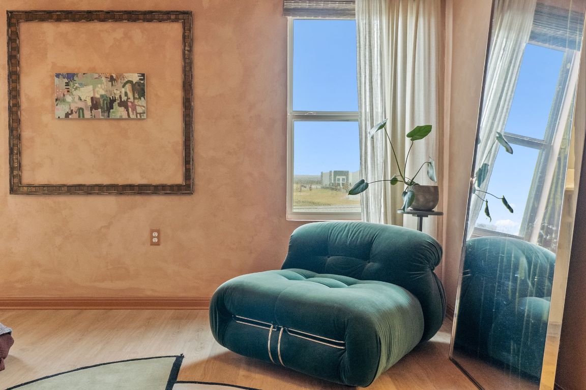 6703 Routenburn Street Austin, TX 78754 - Photo 22 of 34 a living room with furniture and a window