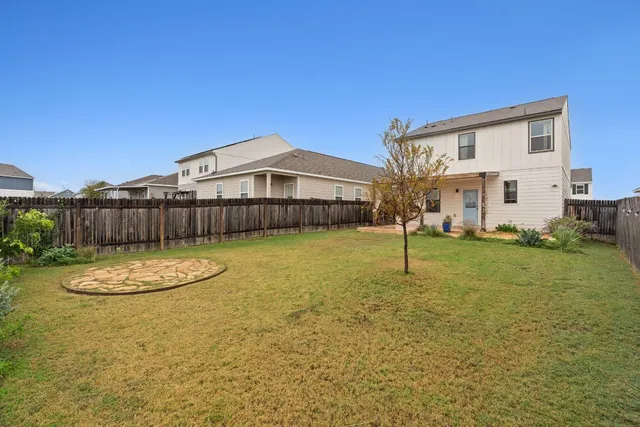 a view of a patio with a table and chairs
