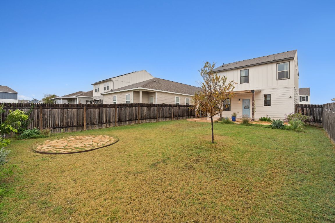 6703 Routenburn Street Austin, TX 78754 - Photo 29 of 34 a view of a patio with a table and chairs