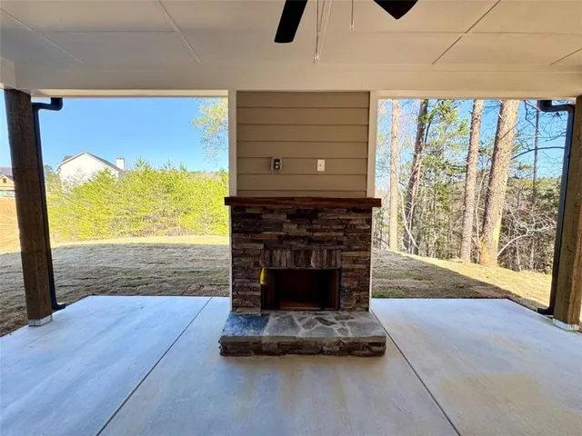 a living room with fireplace furniture and a flat screen tv
