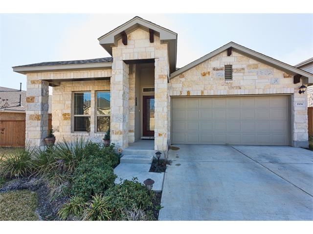 1104 April Meadows Loop Georgetown, TX 78626 - Photo 1 of 1 a front view of a house with a yard