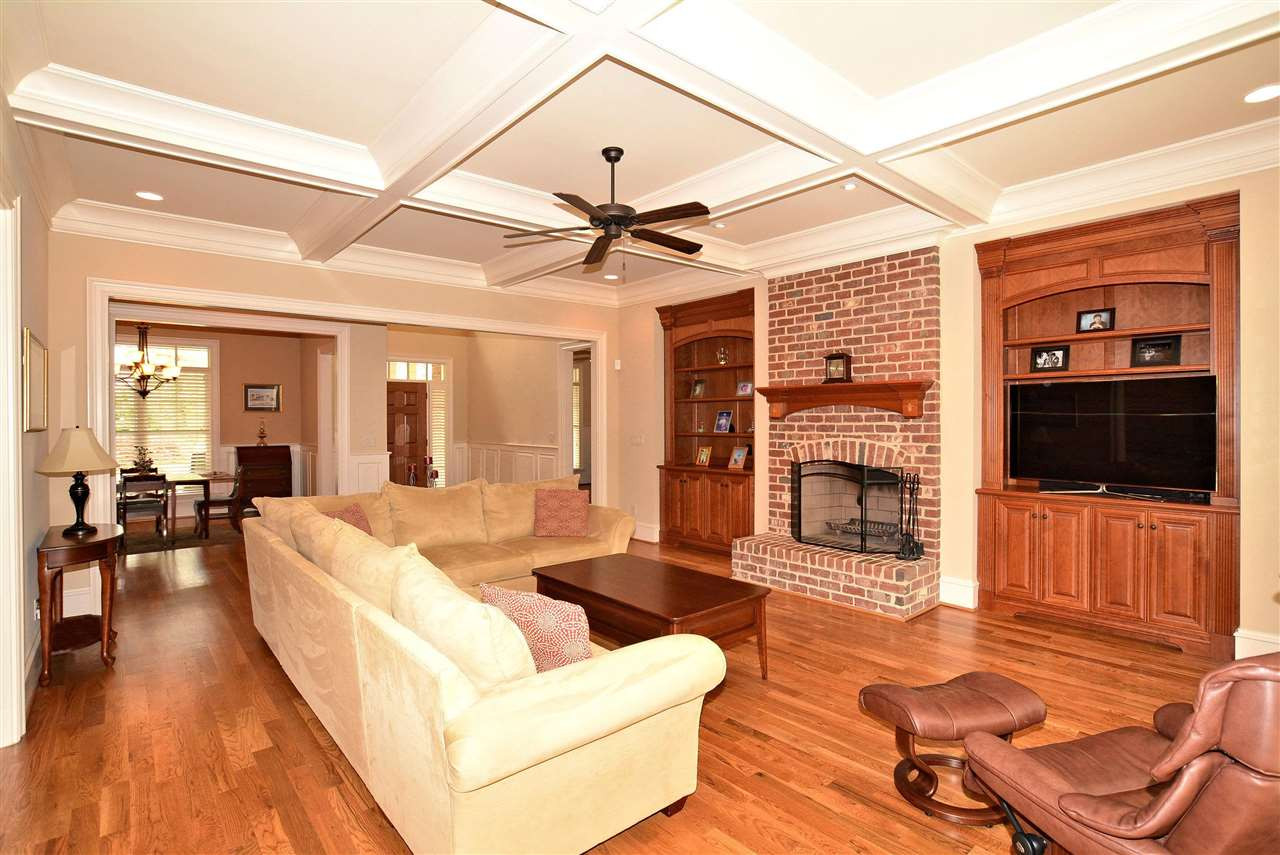 1322 Dogwood Lane Raleigh, NC 27607 - Photo 5 of 30 Family Room features Isokern 36" Masonry Wood Burning FP with Arched Opening & Custom-Built Maple Cabinet Built-ins on each side of Fireplace. Pre-Wired for Surround Sound. Family Room