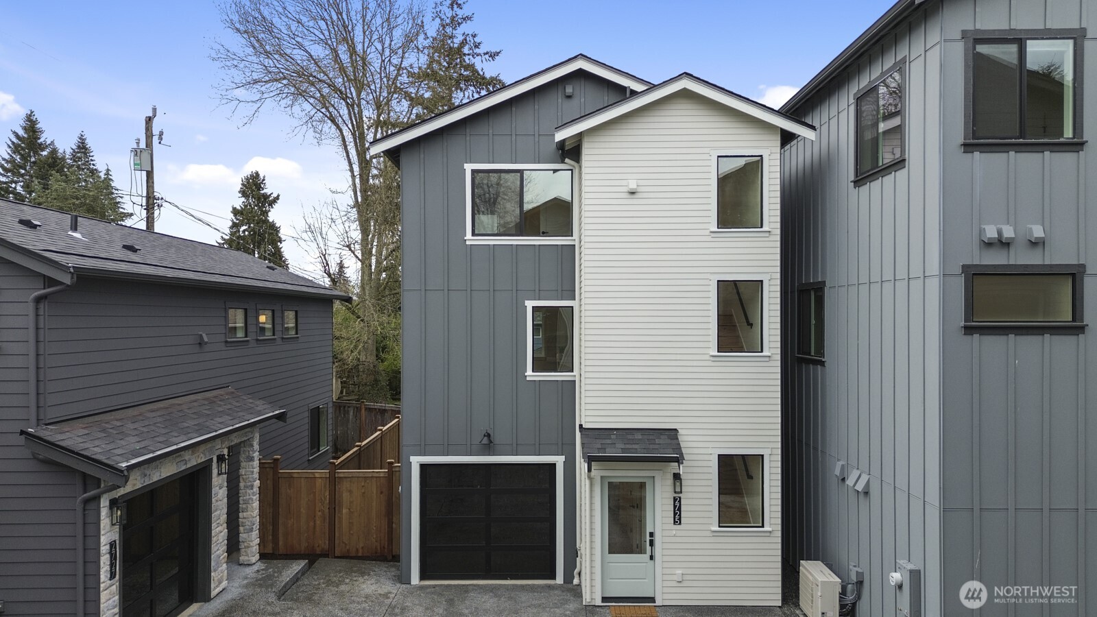 2725 Northeast 87th Street Seattle, WA 98115 - Photo 1 of 30 a front view of a house with garage