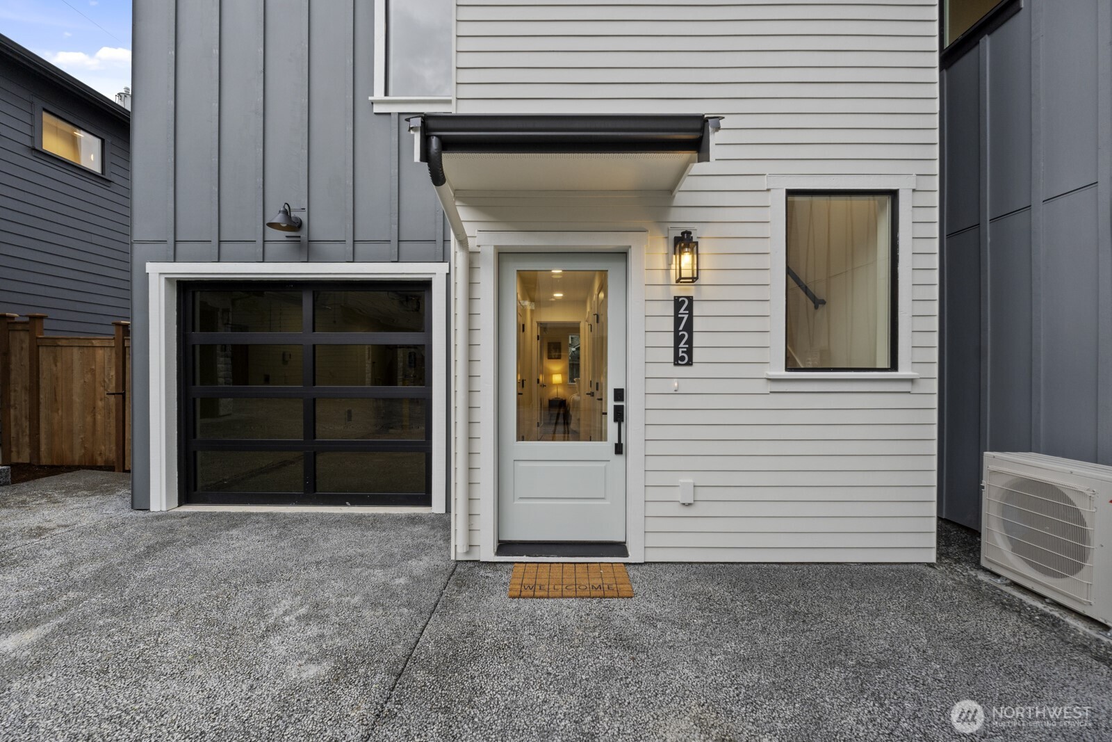 2725 Northeast 87th Street Seattle, WA 98115 - Photo 4 of 30 a view of a house with a door and a yard