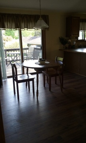 405 Main St Road Spring Grove, IL 60081 - Photo 5 of 10 a view of a dining room with furniture window and wooden floor