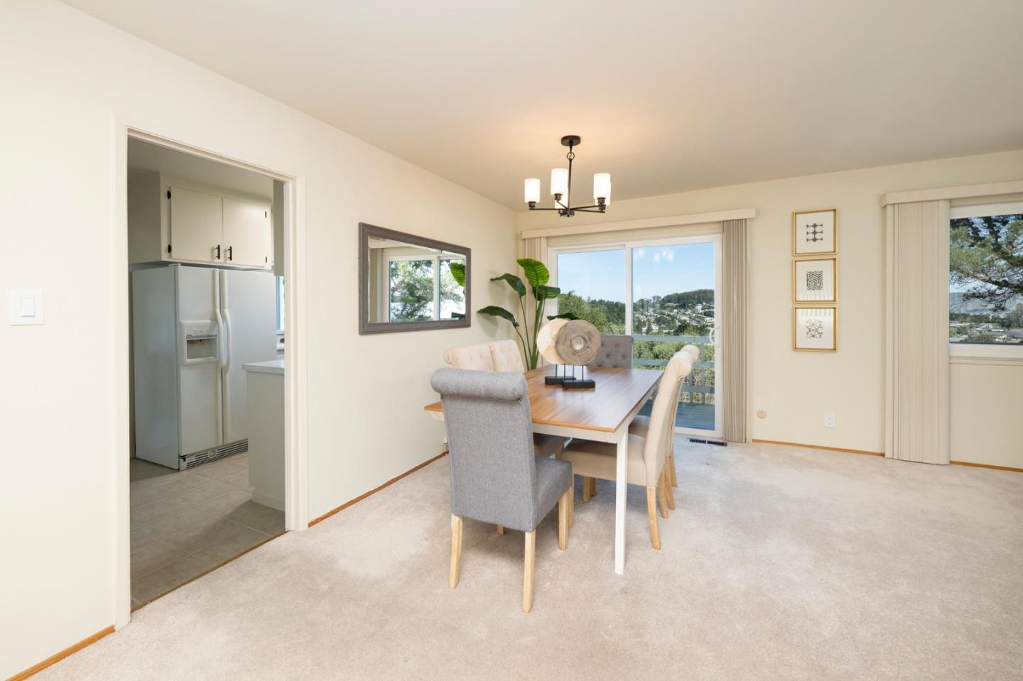 1255 Tuolumne Road Millbrae, CA 94030 - Photo 11 of 42 a view of a dining room with furniture and chandelier