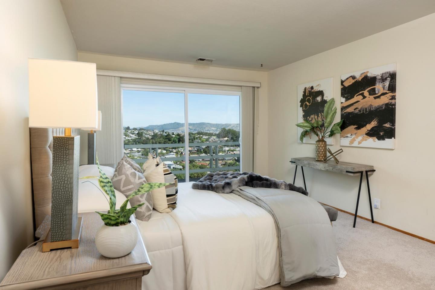 1255 Tuolumne Road Millbrae, CA 94030 - Photo 21 of 42 a bedroom with a bed and a potted plant