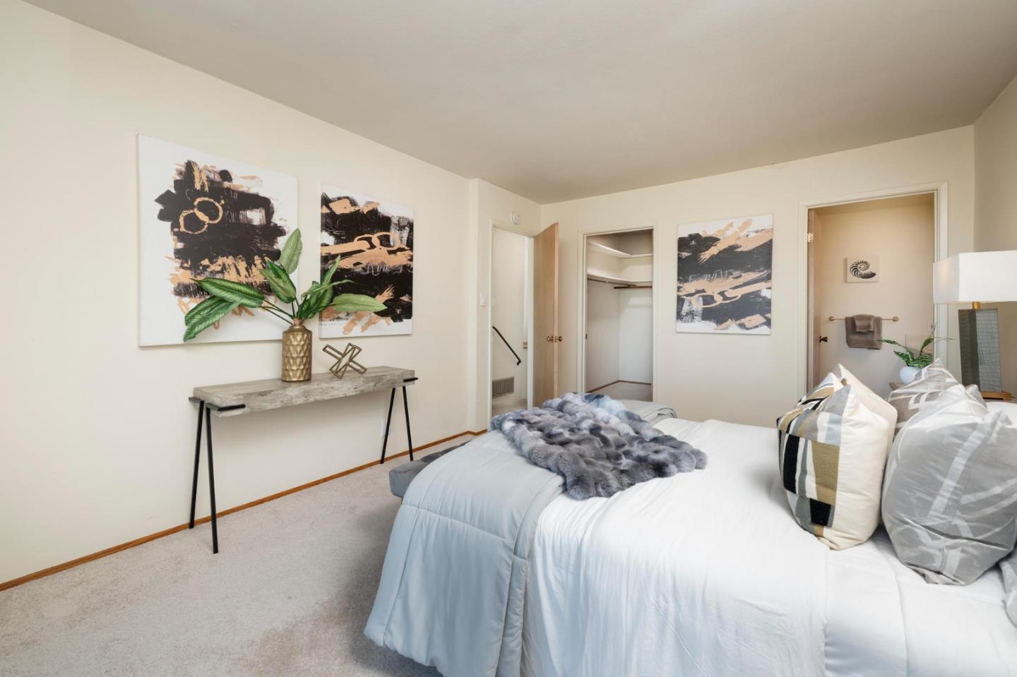 1255 Tuolumne Road Millbrae, CA 94030 - Photo 22 of 42 a bedroom with a bed and a painting on the wall