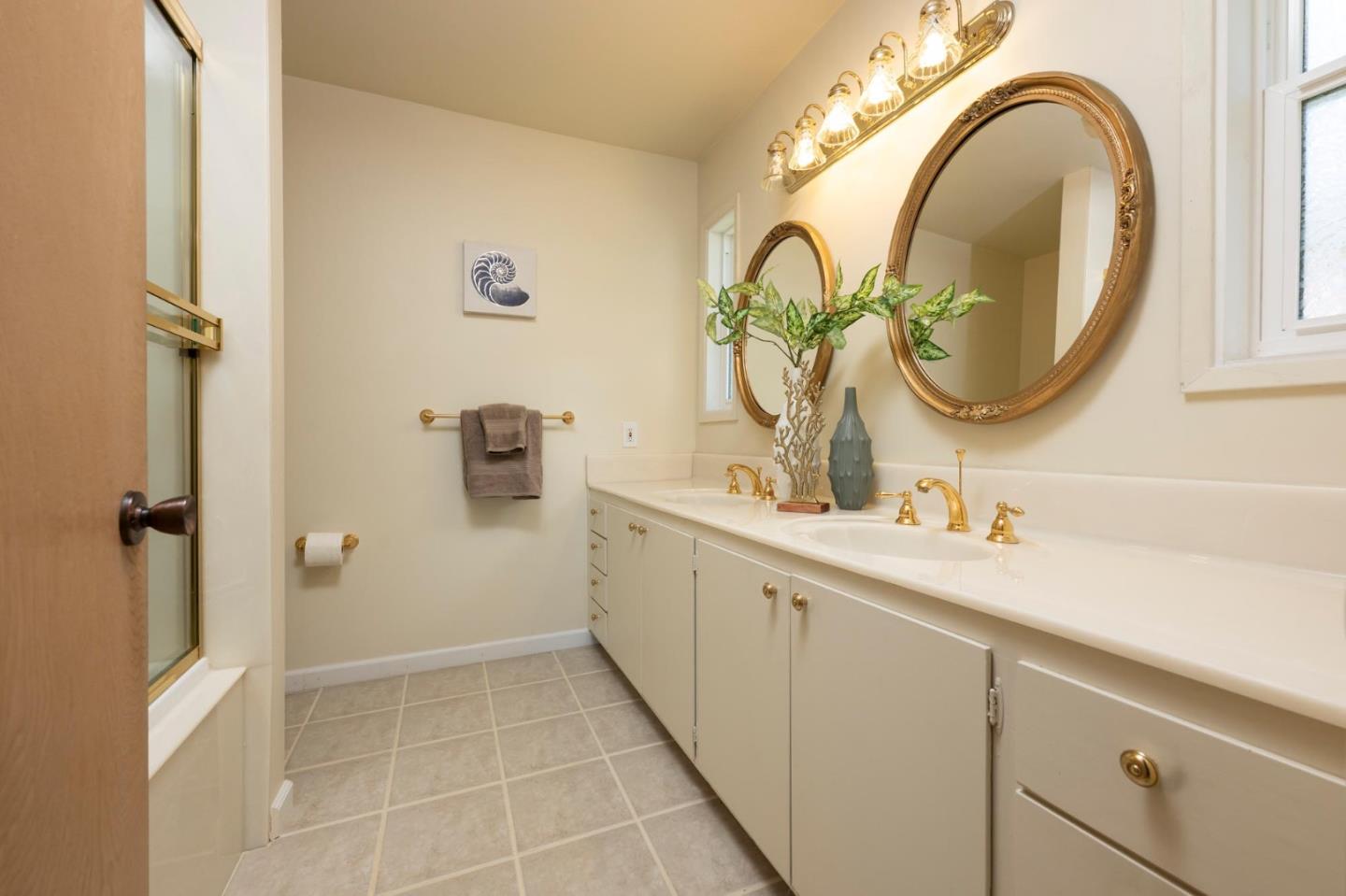 1255 Tuolumne Road Millbrae, CA 94030 - Photo 25 of 42 a bathroom with a sink and a mirror