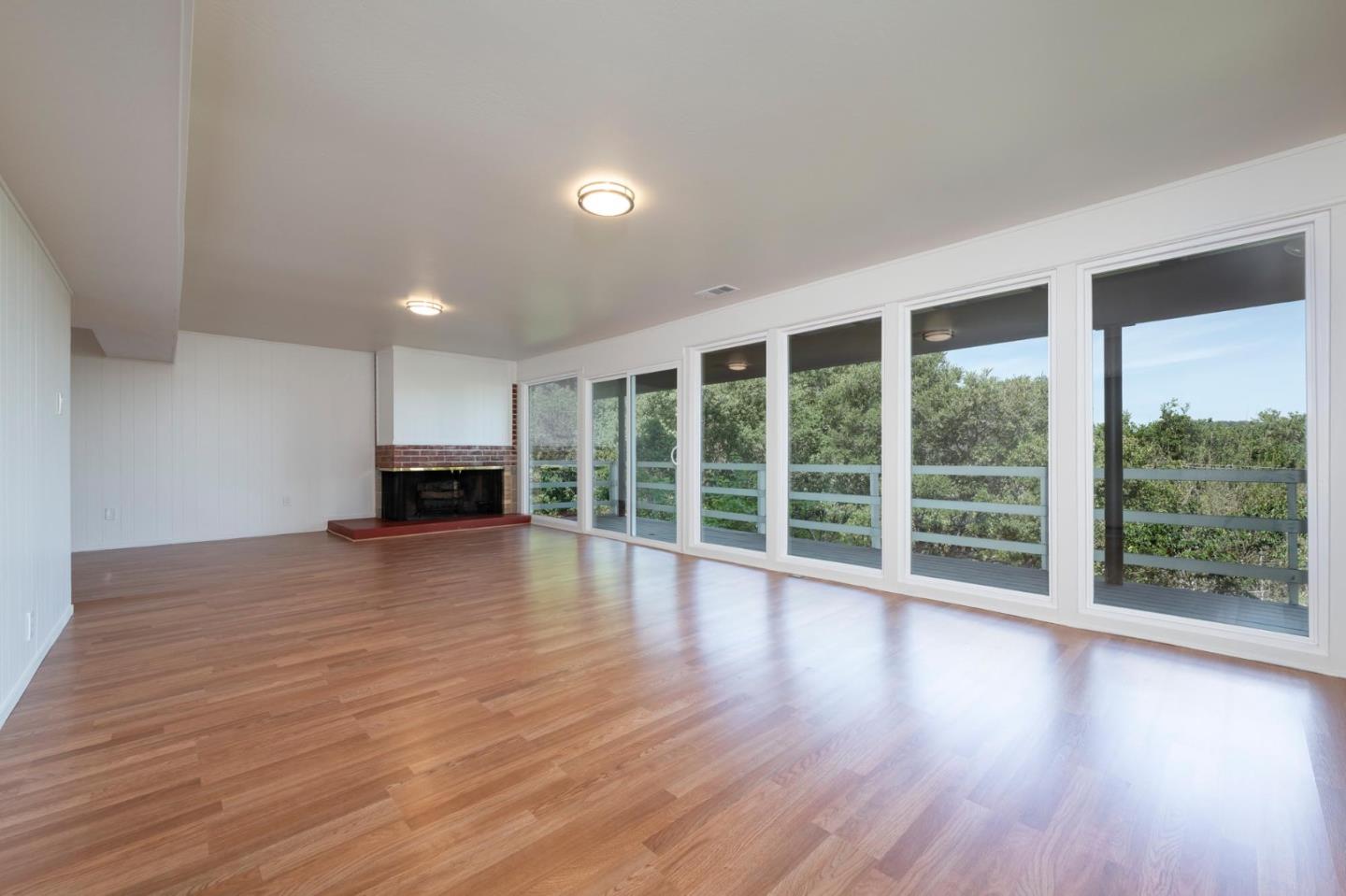1255 Tuolumne Road Millbrae, CA 94030 - Photo 31 of 42 a view of empty room with wooden floor and floor to ceiling window