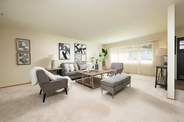 a living room with furniture and a window