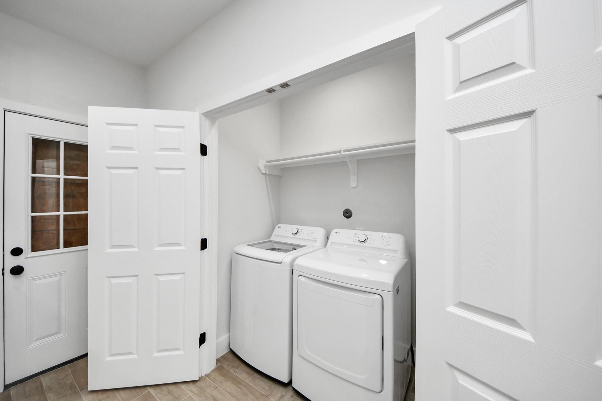 8015 Elbert Street, Unit A/B Houston, TX 77028 - Photo 12 of 12 a utility room with dryer and washer