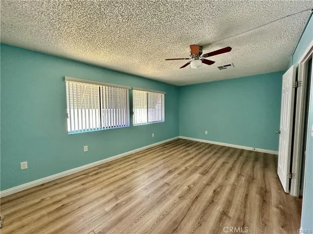 a view of empty room with windows