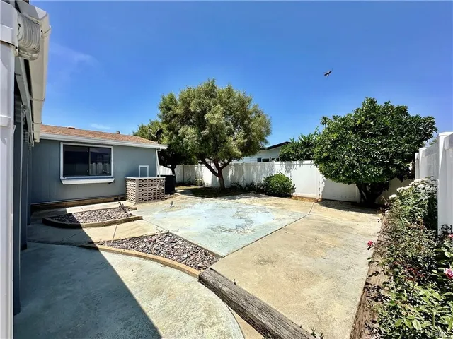 a view of a backyard of the house