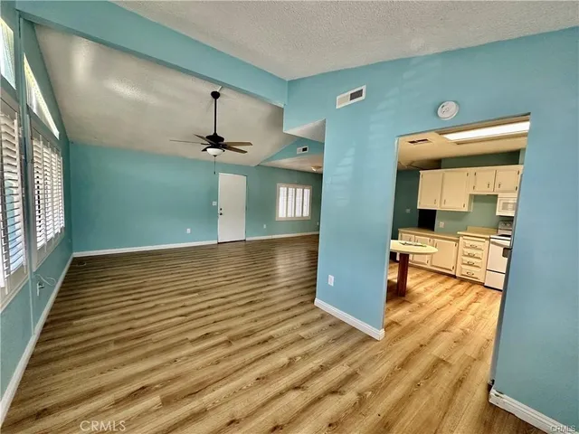 a view of a living room with a wooden floor