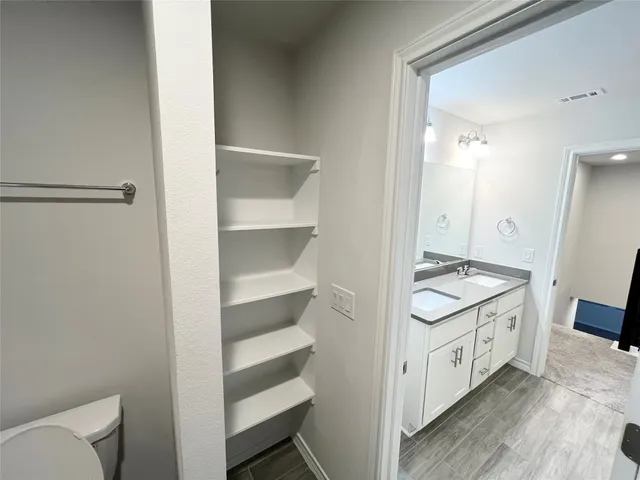 a view of a bathroom with a sink and a toilet