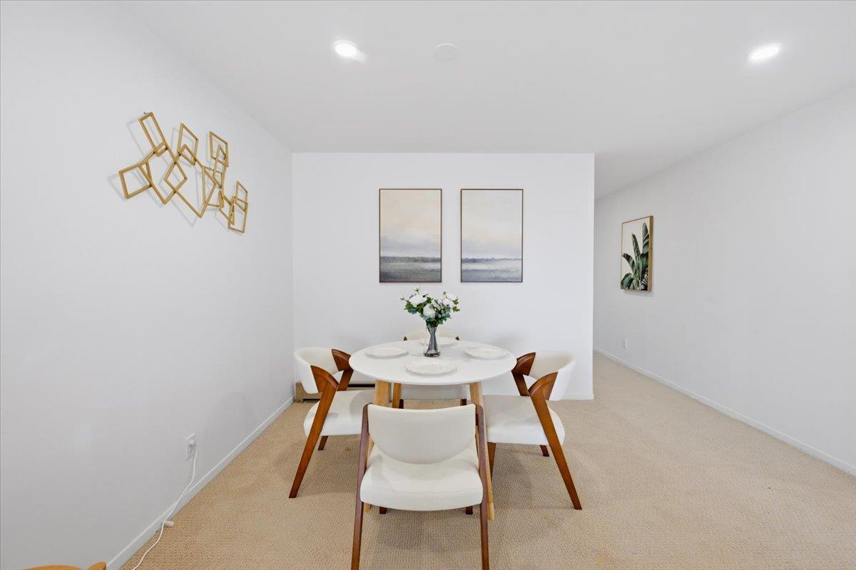 555 Palm Avenue, Unit 202 Millbrae, CA 94030 - Photo 12 of 40 a dining room with furniture and wooden floor