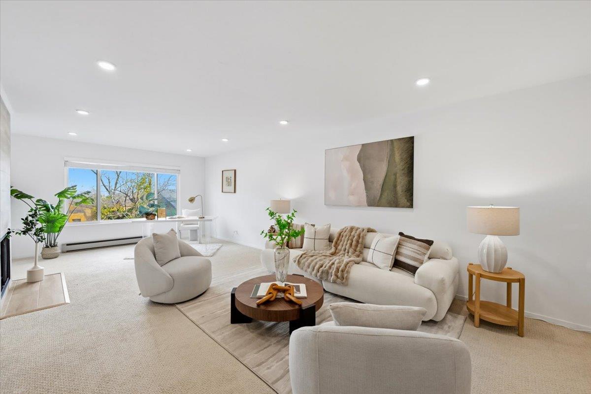 555 Palm Avenue, Unit 202 Millbrae, CA 94030 - Photo 14 of 40 a living room with furniture and a potted plant