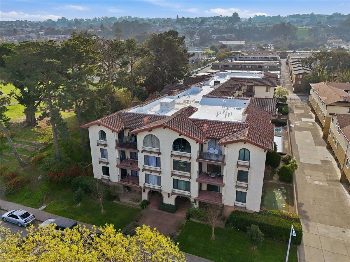 555 Palm Avenue, Unit 202 Millbrae, CA 94030 - Photo 2 of 40 an aerial view of a house with a garden