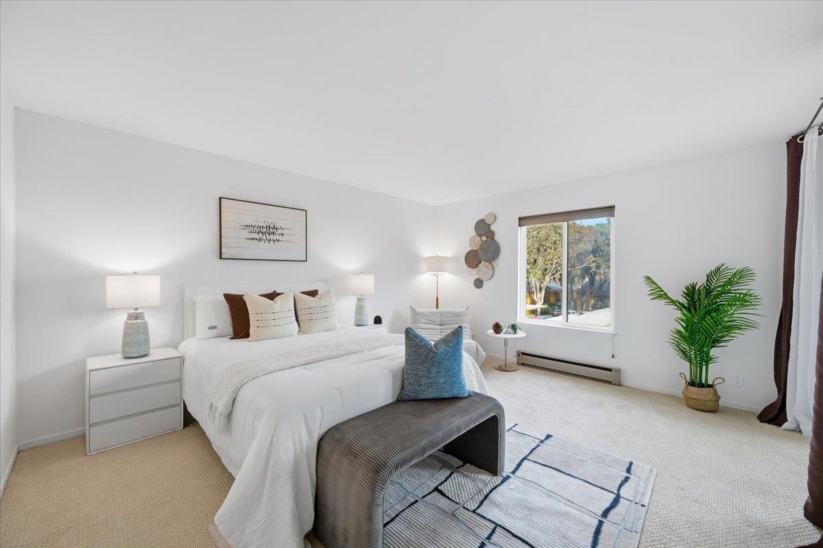 555 Palm Avenue, Unit 202 Millbrae, CA 94030 - Photo 24 of 40 a bedroom with a bed and a couch